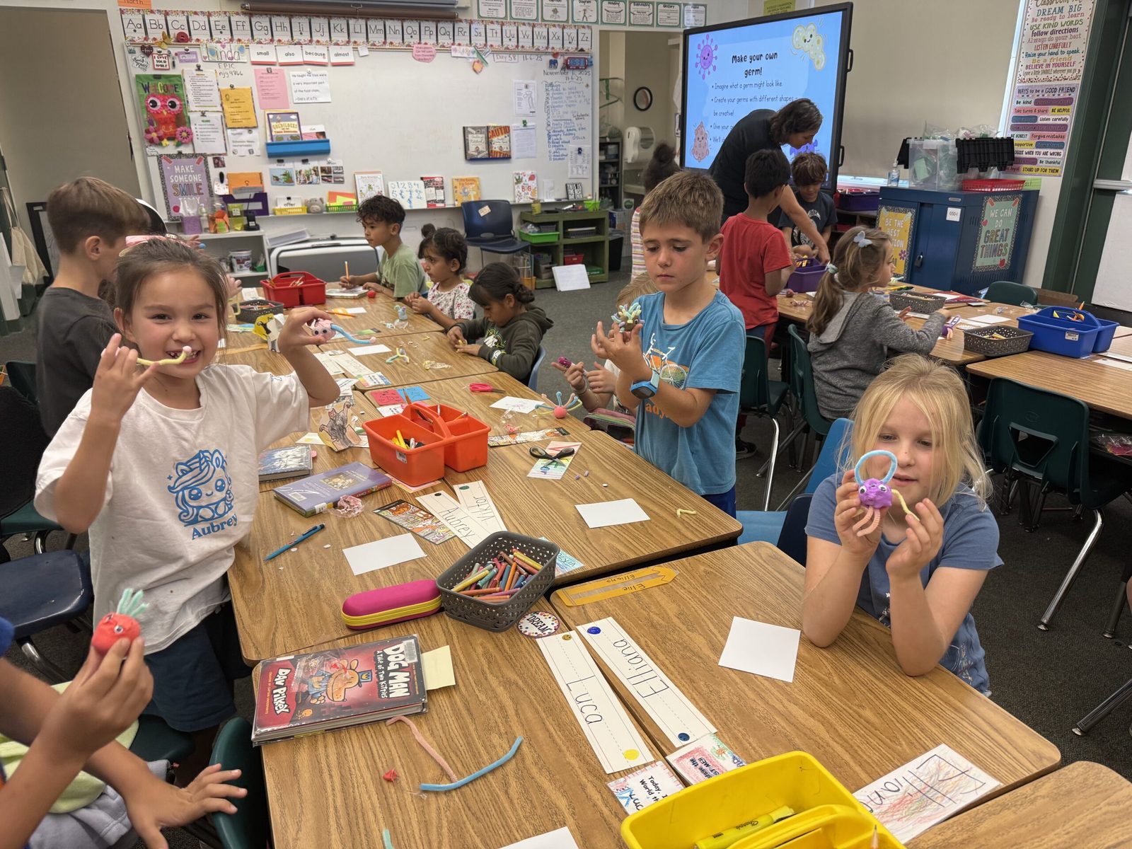 Children showing the germ models they made at a Heart in Hand workshop