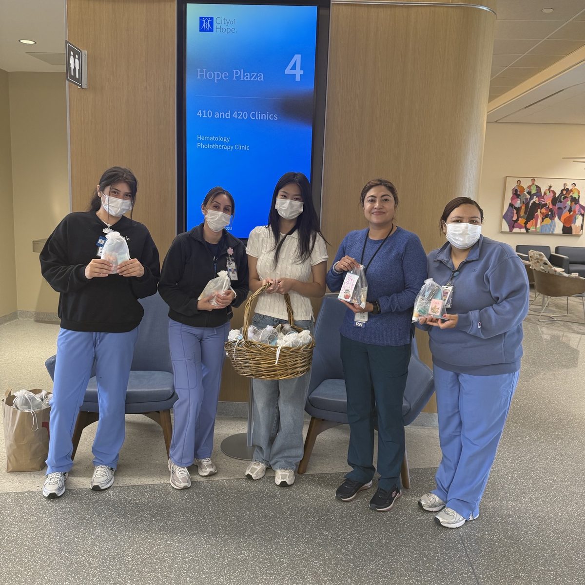 Volunteers delivering care kits with clinical staff at City of Hope