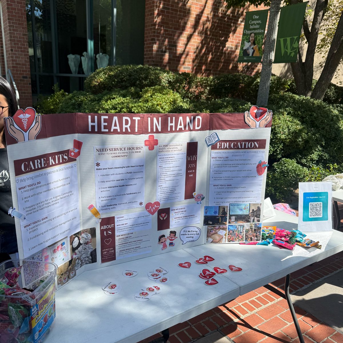 The Heart in Hand table at a school club fair