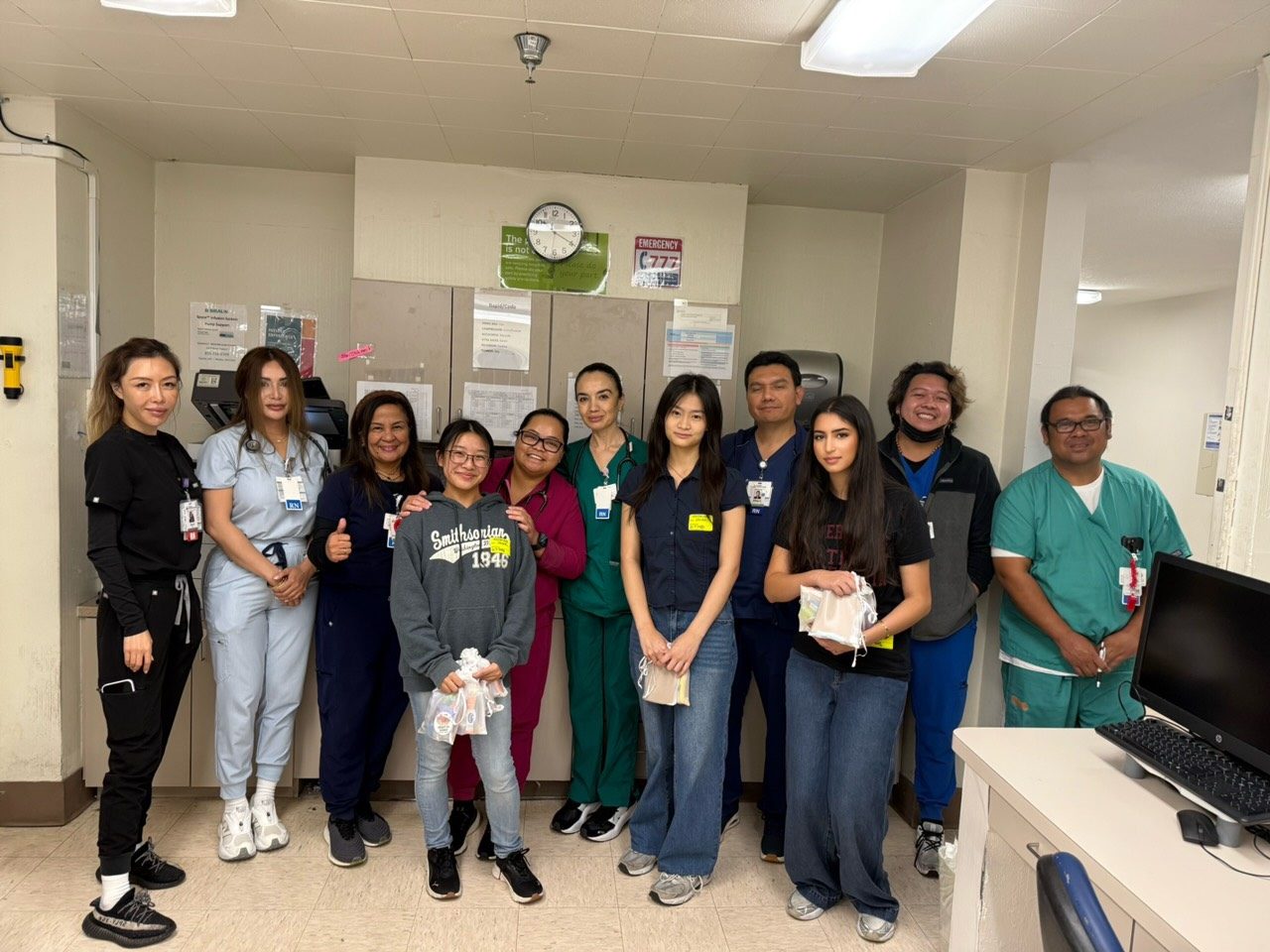 Heart in Hand volunteers with hospital staff after delivering care kits